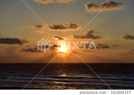 Sea beach with sky sunset or sunrise. Clouds over the sunset sea. Sea beach with sky sunset or sunrise. Clouds over the sunset sea. 101809147