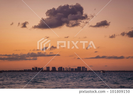 Sunrise or sunrise overlooking the sea and a line of hotels in Cancun Sunrise or sunrise overlooking the sea and a line of hotels in Cancun 101809150