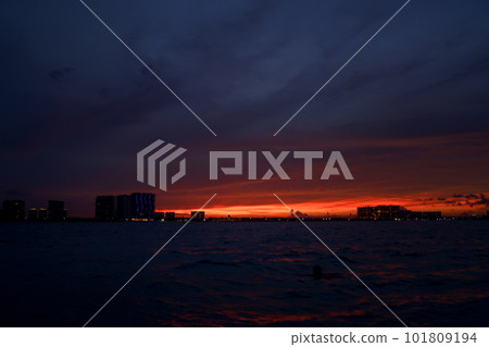 Sunrise or sunrise overlooking the sea and a line of hotels in Cancun Sunrise or sunrise overlooking the sea and a line of hotels in Cancun 101809194