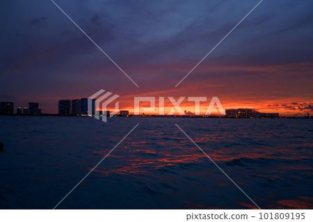 Sunrise or sunrise overlooking the sea and a line of hotels in Cancun Sunrise or sunrise overlooking the sea and a line of hotels in Cancun 101809195