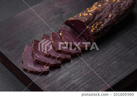Delicious smoked Armenian basturma with spices and herbs Delicious smoked Armenian basturma with spices and herbs 101809360