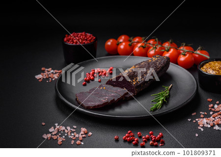 Delicious smoked Armenian basturma with spices and herbs 101809371