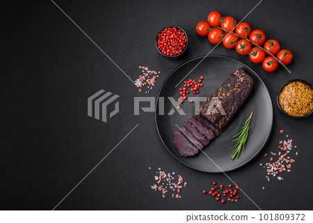 Delicious smoked Armenian basturma with spices and herbs 101809372