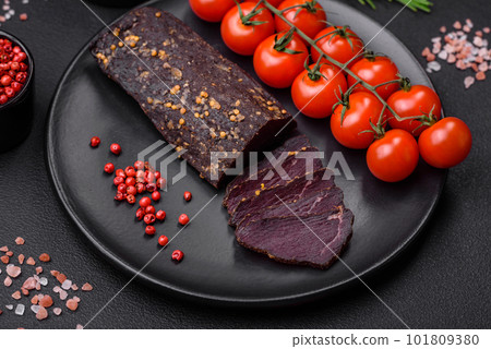 Delicious smoked Armenian basturma with spices and herbs 101809380