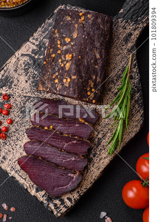Delicious smoked Armenian basturma with spices and herbs 101809394