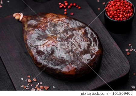 Tasty mahan, prosciutto or jamon on a wooden cutting board 101809403
