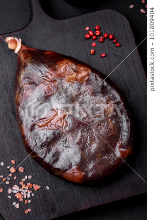Tasty mahan, prosciutto or jamon on a wooden cutting board 101809404