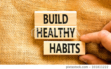 Motivation and Build healthy habits symbol. Concept words Build healthy habits on wooden block on a beautiful canvas table canvas background. Business build healthy habits concept. Copy space. 101811222