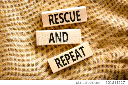 Rescue and repeat symbol. Concept words Rescue and repeat on wooden block on a beautiful canvas table canvas background. Business rescue and repeat concept. Copy space. 101811227
