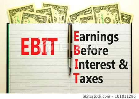 EBIT symbol. Concept words EBIT earnings before interest and taxes on white note on beautiful white background. Dollar bills. Business EBIT earnings before interest and taxes concept. Copy space. 101811296