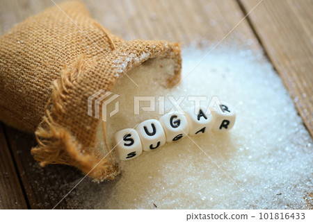 white sugar for food and sweets dessert candy heap of sweet sugar crystalline granulated, Sugar on sack and wooden background 101816433