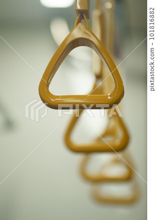 Close up and selective focus of yellow triangle handle bar in the train. 101816882