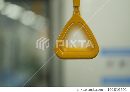 Close up and selective focus of yellow triangle handle bar in the train. 101816891