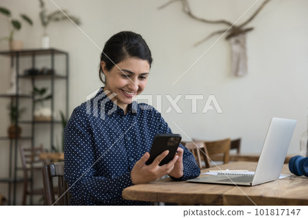 Happy woman holds mobile phone, read news, write sms Happy woman holds mobile phone, read news, write sms 101817147