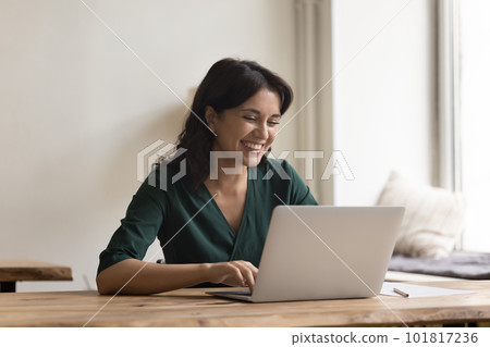 Positive attractive business woman enjoy chatting with colleagues online Positive attractive business woman enjoy chatting with colleagues online 101817236