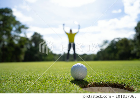 Blurred golfer playing golf in the evening golf course, on sun set evening time. Blurred golfer playing golf in the evening golf course, on sun set evening time. 101817363