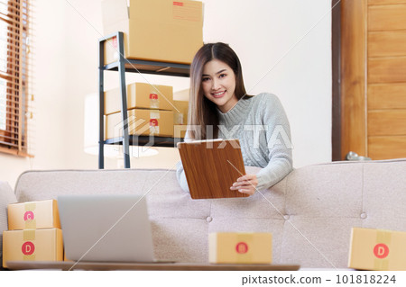 Small businesses SME owners female entrepreneurs check online orders to prepare to pack the boxes, sell to customers, sme business ideas online 101818224