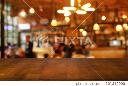 Empty wooden table in front of abstract blurred background of coffee shop . can be used for display or montage your products.Mock up for display of product Empty wooden table in front of abstract blurred background of coffee shop . can be used for display or montage your products.Mock up for display of product 101819000