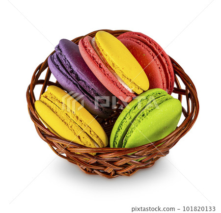Basket of traditional french macaroons isolated on a white background Basket of traditional french macaroons isolated on a white background 101820133