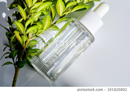 Serum with a dropper with spring flowers. Serum with a dropper with spring flowers. 101820802