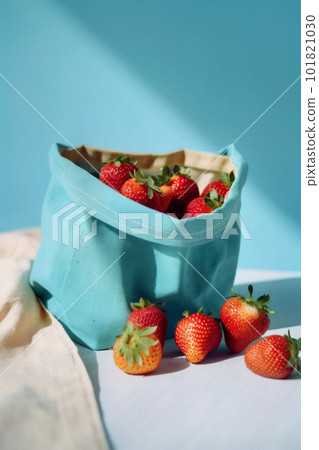 Freshly harvested red strawberries in a light blue bag 101821030