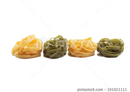 Italian fettuccine pasta in the form of a nest. Italian fettuccine pasta in the form of a nest. 101821111