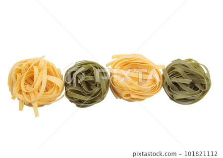 Italian fettuccine pasta in the form of a nest. Italian fettuccine pasta in the form of a nest. 101821112