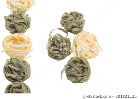 Italian fettuccine pasta in the form of a nest. Italian fettuccine pasta in the form of a nest. 101821126