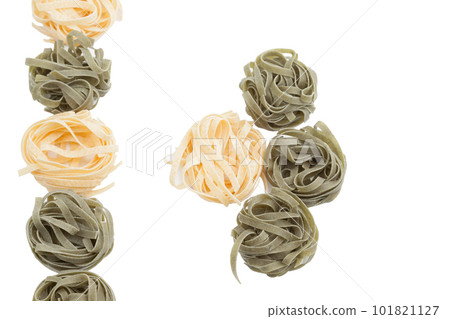 Italian fettuccine pasta in the form of a nest. Italian fettuccine pasta in the form of a nest. 101821127