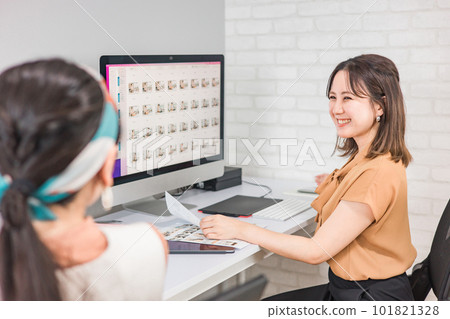 A woman who works as a photo editor, image editor, photo processor, retoucher, and graphic designer 101821328