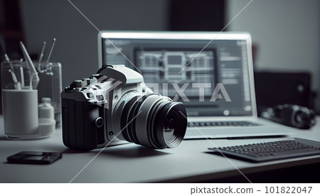 Photographer's workplace with a modern equipment. Mirrorless camera, laptop and prime lenses. Photographer's workplace with a modern equipment. Mirrorless camera, laptop and prime lenses. 101822047