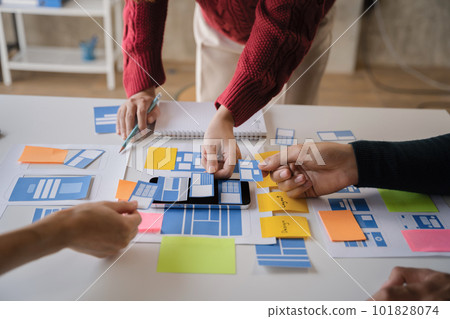 Creative team web designer planning application development for web mobile phone at modern workplace. Creative team web designer planning application development for web mobile phone at modern workplace. 101828074