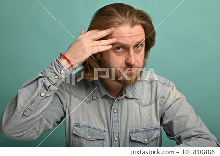 Man in front of mirrror looking at his wrinkles Man in front of mirrror looking at his wrinkles 101830886