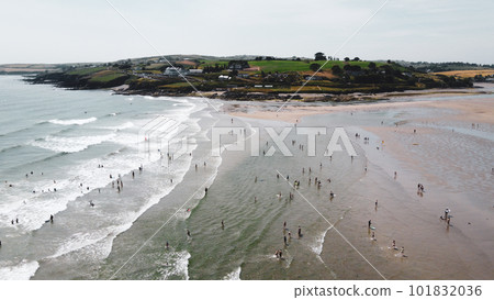 Many Irish on the famous sandy beach of Inchydoney on a summer day, top view. Seaside Irish landscape. The Coast Of The Atlantic Ocean. 101832036