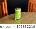 Close up of organic green apples and kiwi green fresh juice in glass with fresh oranges. 101832219