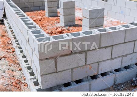 It is common for cement blocks be laid for walls that will attached to house foundation during construction. It is common for cement blocks be laid for walls that will attached to house foundation during construction. 101832248