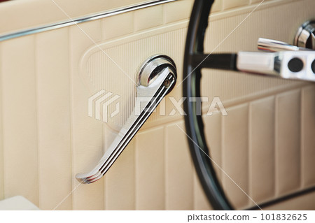 Beige leather vintage car door with metal handle Beige leather vintage car door with metal handle 101832625