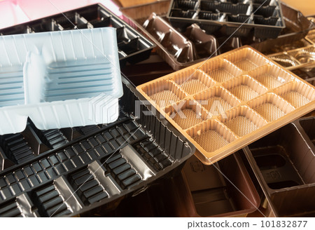 Many partitioned trays, sweets trays, plastic containers and packaging, sorted garbage Many partitioned trays, sweets trays, plastic containers and packaging, sorted garbage 101832877