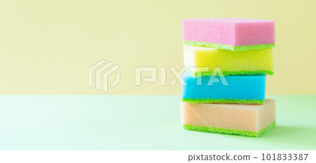 Cleaning concept - colorful dishwashing sponges on bright background 101833387