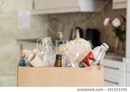 Recycling concept - box of recycling materials in kitchen background 101833390