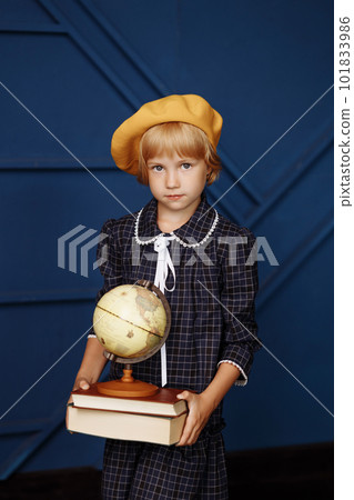 Schoolgirl studying globe 101833986