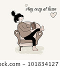 girl reads a book in warm clothes in an armchair. 101834127