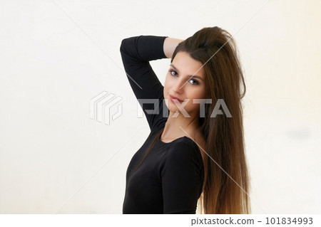 Attractive girl is posing on the light background. Attractive girl is posing on the light background. 101834993