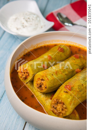 Recipe of stuffed courgette with tomato sauce, Lebanese style, Kouca Mehchi bi Banadoura, with Greek Recipe of stuffed courgette with tomato sauce, Lebanese style, Kouca Mehchi bi Banadoura, with Greek 101835041
