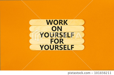 Work for yourself symbol. Concept words Work on yourself for yourself on wooden stick. Beautiful orange table orange background. Business and work for yourself concept. Copy space. 101838211