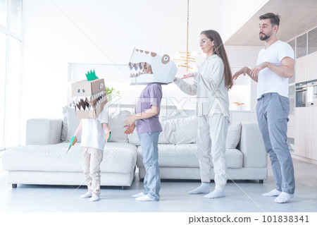 Family playing dinosaurs at home 101838341