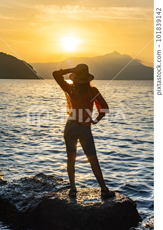 back view of young girl over sea sunset on Amalfi coast. Travel, relax, vacation back view of young girl over sea sunset on Amalfi coast. Travel, relax, vacation 101839142