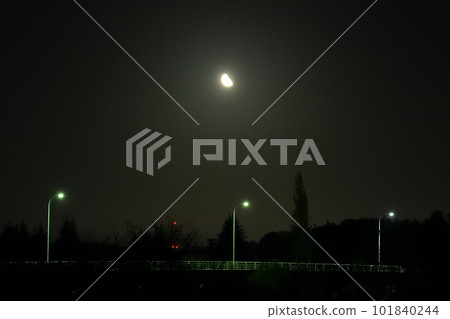 A waning moon with an age of 22.4 above an outdoor light in Takekawa-cho, Hokuto City 101840244