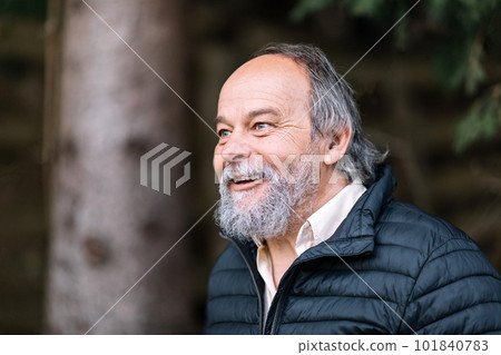 Portrait of a smiling, confident, handsome, mature man during his walk, senior 101840783