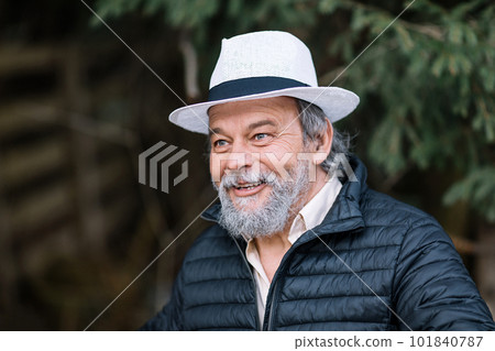 Portrait of a smiling, confident, handsome, mature man during his walk, senior Portrait of a smiling, confident, handsome, mature man during his walk, senior 101840787